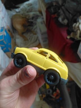 yellow Green Toys Mini Car, an eco-friendly miniature vehicle